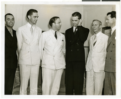 Photograph of Howard Hughes and a group of men, 1938