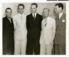 Photograph of Howard Hughes and a group of men, August 01, 1938