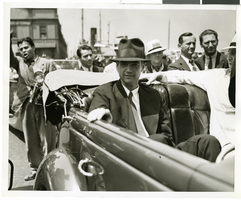 Photograph of Howard Hughes and crew at a parade, New York, July 15, 1938