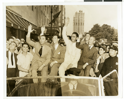 Photograph of Howard Hughes and crew at a parade, New York, July 15, 1938