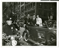 Photograph of Howard Hughes and his crew at a parade, New York, July 15, 1938