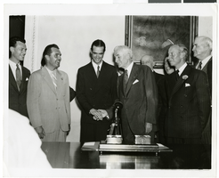 Photograph of Howard Hughes and other men, July 21, 1938