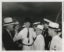 Photograph of Howard Hughes amongst crowd, Chicago, 1938