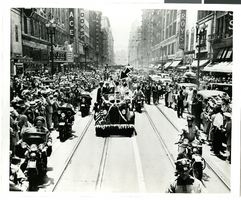 Photograph of a parade for Howard Hughes presumably in Texas, 1938
