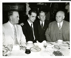 Photograph of Howard Hughes and other men at a banquet in Los Angeles, August 1, 1938