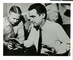 Photograph of Howard Hughes talking to newspapermen, Los Angeles, August 1, 1938