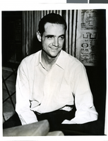 Photograph of Howard Hughes talking to newspapermen, Los Angeles, August 1, 1938