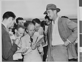 Photograph of Howard Hughes with reporters, Washington, August 06, 1947