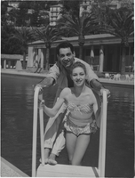Photograph of Vassili Sulich and a ballerina from the Ballet de Monte Carlo posing on a pool ladder, Monte Carlo, 1956-1958