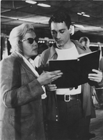 Photograph of Vassili with an unidentified woman reading a film script, early 1960s