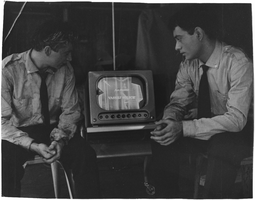 Photograph of Milko Šparemblek and Vassili Sulich watching a television production of "Son Double," 1950s-1960s