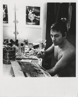 Photograph of Vassili Sulich working on one of his paintings backstage at the Tropicana Hotel, Las Vegas, Nevada,1960s