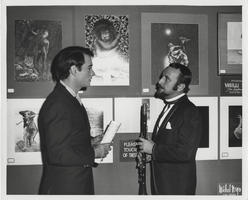 Photograph of Vassili Sulich and an unidentified man at an exhibit of Sulich's paintings, Tropicana Hotel, Las Vegas, Nevada, 1960s
