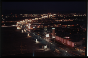 Color view of the Strip at night. The Flamingo Hotel is visible in the foreground.