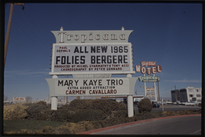 Color view of the Tropicana marquee advertising Paul Derval's All new Follies Bergere, 1965. Also headlining are the Mary Kaye Trio and Carmen Cavallaro.
