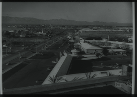 Black and white view of the Thunderbird Hotel. The El Rancho Vegas Hotel is visible in the background.