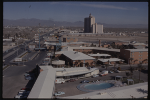 Color view of the Thunderbird Hotel. The El Rancho Vegas Hotel and the Sahara Hotel are visible in the background.