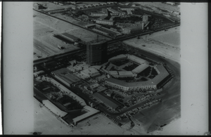 Black and white aerial view of the Dunes Hotel under construction.