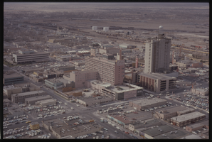 Color aerial view of the Fremont Hotel under construction. Lucky and The Mint are also visible.