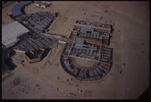 Color aerial view of a building under construction.