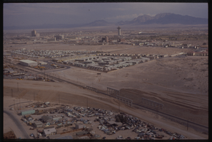 Color aerial view of the Las Vegas Valley. The Landmark Hotel is visible in the background.