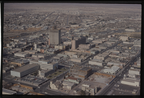 Color aerial view of Las Vegas. The Fremont Hotel, Bionion's Horseshoe Hotel (currently under construction), Lucky, and the Golden Nugget are visible.