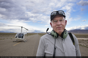 Brian Painter with Robinson R44 helicopter on a road, near Tonopah, Nevada: digital photograph