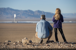 Jimmy Long, helicopter pilot, and Ciela Stillings, Jamey's daughter near the Crescent Dunes Solar Power plan outside of Tonopah, Nevada: digital photograph