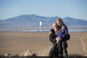 Jamey Stillings and his daughter Ciela, age 8, near the Crescent Dunes Solar Power plan outside of Tonopah, Nevada: digital photograph