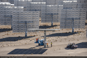 Workers adjust a heliostat at Crescent Dunes Solar, near Tonopah, Nevada: digital photograph