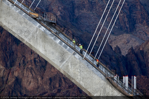 Photograph of ironworkers on the Mike O'Callaghan-Pat Tillman Memorial Bridge arch, Nevada-Arizona border, April 30, 2009