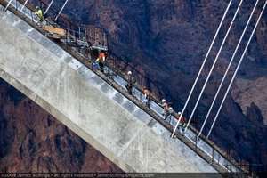 Photograph of ironworkers on the Mike O'Callaghan-Pat Tillman Memorial Bridge arch, Nevada-Arizona border, April 30, 2009