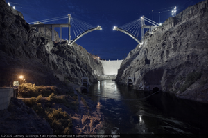 Photograph showing an upstream view of Hoover Dam and the Mike O'Callaghan-Pat Tillman Memorial Bridge under construction, Nevada-Arizona border, May 21, 2009