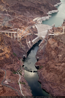 Photograph showing an aerial view of Lake Mead, Hoover Dam, and the Mike O'Callaghan-Pat Tillman Memorial Bridge under construction, Nevada-Arizona border, June 30, 2009
