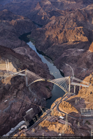 Photograph showing an aerial view of Mike O'Callaghan-Pat Tillman Memorial Bridge construction, the hairpin turn on the Nevada side of Hoover Dam, and the Colorado River, June 30, 2009