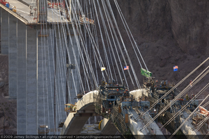 Photograph of arch construction for the Mike O'Callaghan-Pat Tillman Memorial Bridge and the bridge's deck at the Nevada border, July 1, 2009