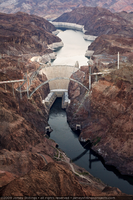 Photograph showing an aerial view of the completed arch of the Mike O'Callaghan-Pat Tillman Memorial Bridge, Hoover Dam, Lake Mead, and the Colorado River, September 10, 2009