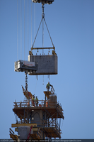 Photograph of a precast pier segment traveling by the highline crane to its intended position for installation in the Mike O'Callaghan-Pat Tillman Memorial Bridge, Nevada-Arizona border, November 24, 2009