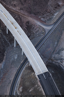 Photograph showing an aerial view of the Hoover Dam bypass highway intersecting with the original road leading to the dam, Arizona border, February 3, 2010