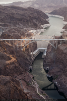 Photograph showing an aerial view of the structurally complete Mike O'Callaghan-Pat Tillman Memorial Bridge, Colorado River, Hoover Dam, and Lake Mead, July 27, 2010