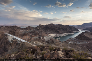 Photograph of the Mike O'Callaghan-Pat Tillman Memorial Bridge under construction, Hoover Dam, and Lake Mead as seen from Sugarloaf Mountain near the Arizona-Nevada border, July 30, 2010