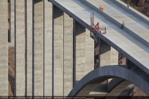 Photograph of workers inspecting the Mike O'Callaghan-Pat Tillman Memorial Bridge, Nevada-Arizona border, July 30, 2010