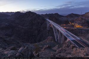 Photograph of the Mike O'Callaghan-Pat Tillman Memorial Bridge at dusk as seen from Sugarloaf Mountain near the Arizona-Nevada border, January 13, 2011