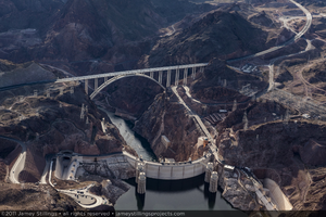 Photograph showing an aerial view of the Colorado River, Mike O'Callaghan-Pat Tillman Memorial Bridge, Hoover Dam, and Lake Mead, January 14, 2011