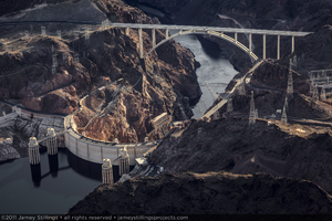 Photograph showing an aerial view of the Colorado River, Mike O'Callaghan-Pat Tillman Memorial Bridge, Hoover Dam, and Lake Mead, January 14, 2011