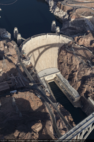 Photograph showing an aerial view of the Mike O'Callaghan-Pat Tillman Memorial Bridge casting a shadow over the face of Hoover Dam, Nevada-Arizona border, January 14, 2011