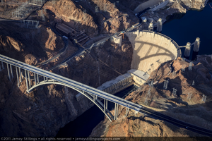 Photograph showing an aerial view of the Mike O'Callaghan-Pat Tillman Memorial Bridge and Hoover Dam, Nevada-Arizona border, January 14, 2011