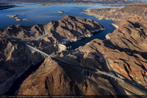 Photograph showing an aerial view of the Mike O'Callaghan-Pat Tillman Memorial Bridge, Hoover Dam, and Lake Mead, Nevada-Arizona border, January 14, 2011
