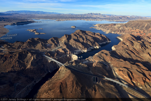 Photograph showing an aerial view of the Mike O'Callaghan-Pat Tillman Memorial Bridge, Hoover Dam, and Lake Mead, Nevada-Arizona border, January 14, 2011