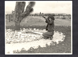 Clara Bow Bell aiming a rifle at Walking Box Ranch, Nevada: photographic print